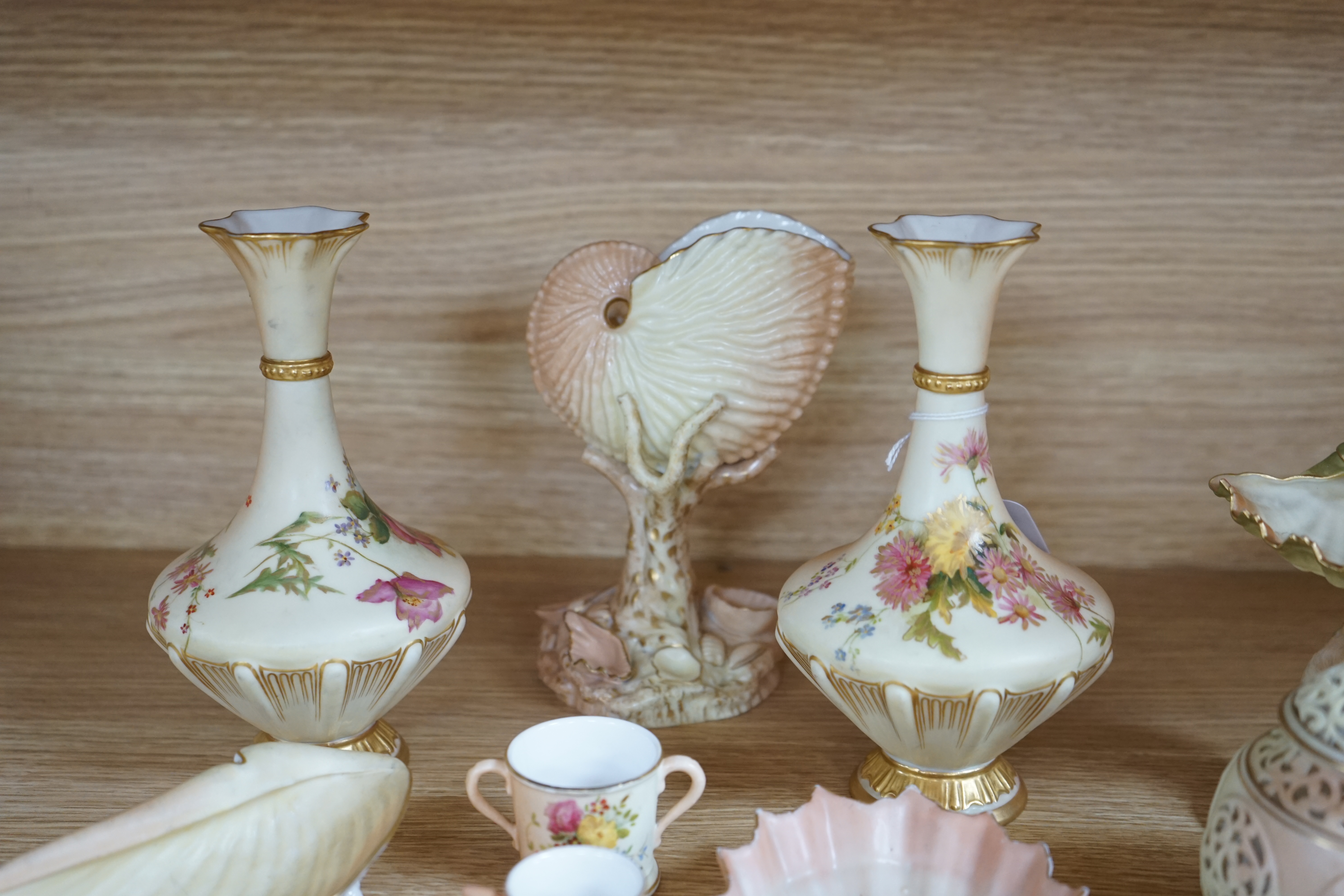 Fourteen Worcester ivory and blush ivory vases, vessels, etc. tallest 17.5cm. Condition - fair to good